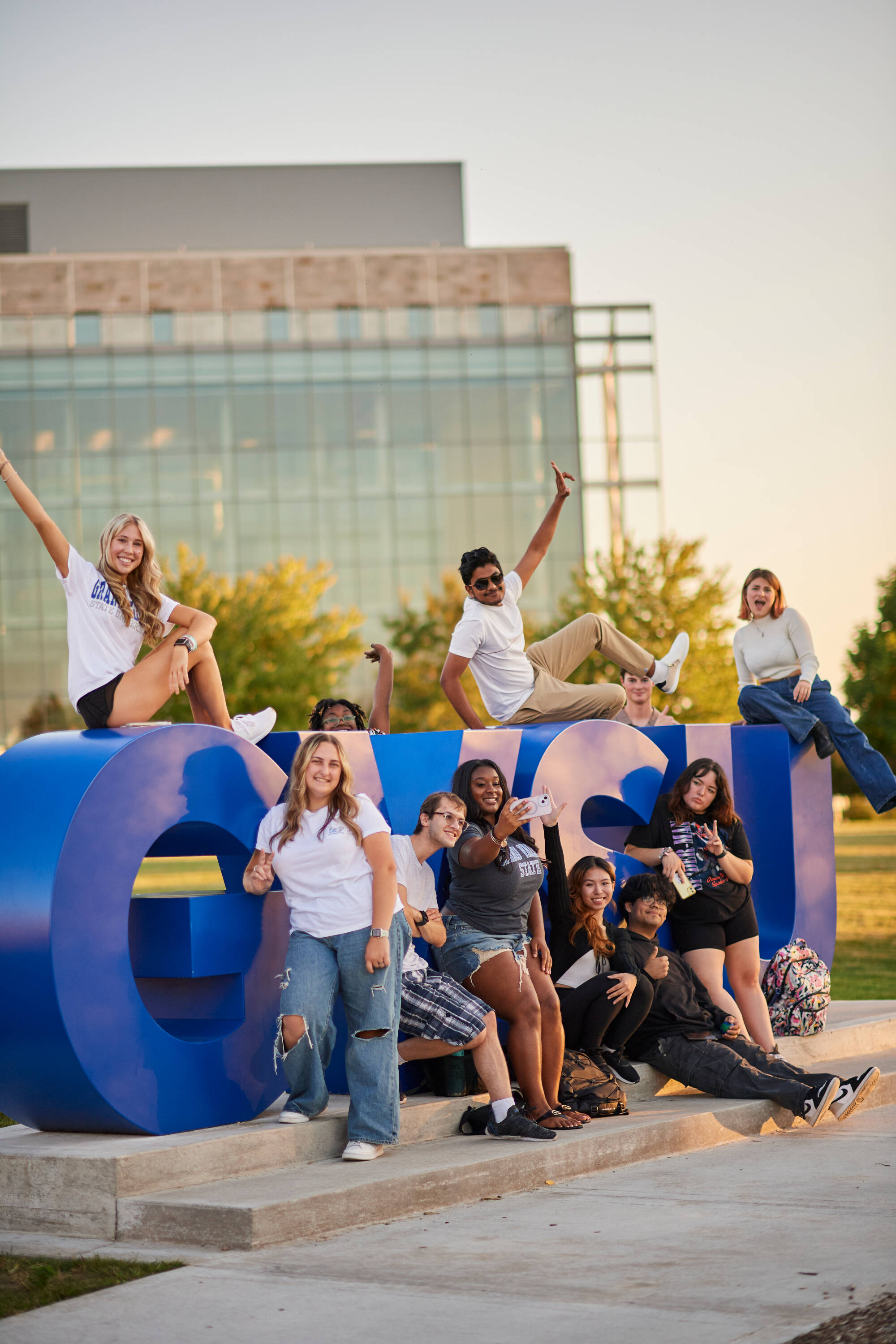 Students posing with GVSU sign